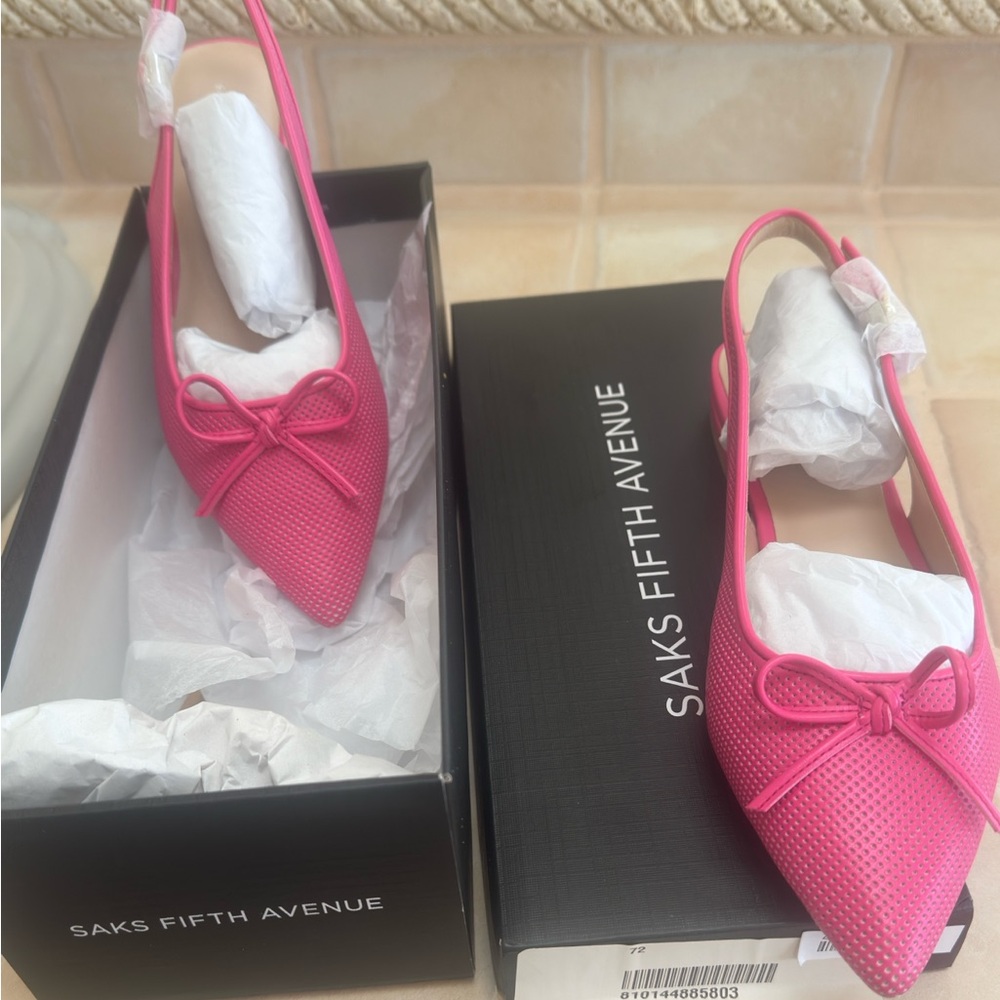 Pink flats from Saks. NWT. Size 7